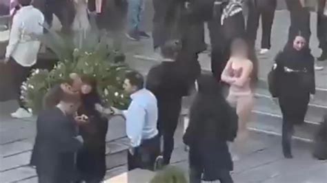 clothes torn off|Iranian woman detained after taking clothes off at。